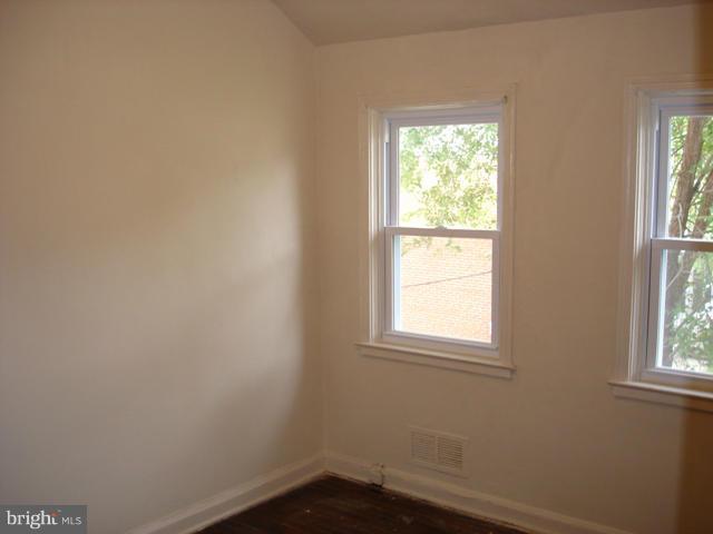 1061 Cameron Road Baltimore, MD 21212 - Photo 4 of 8 an empty room with a window