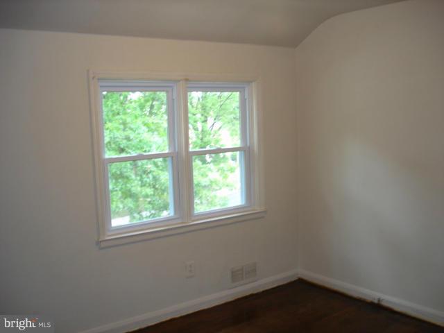 1061 Cameron Road Baltimore, MD 21212 - Photo 5 of 8 an empty room with a window