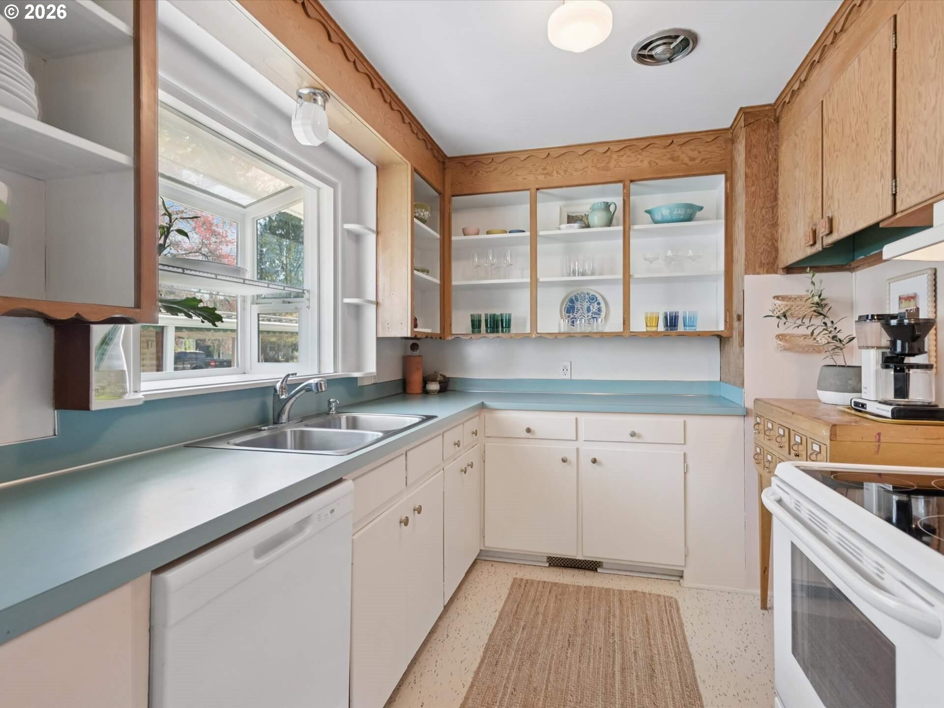 6030 Southeast 80th Avenue Portland, OR 97206 - Photo 14 of 42 a kitchen with granite countertop a sink and a window