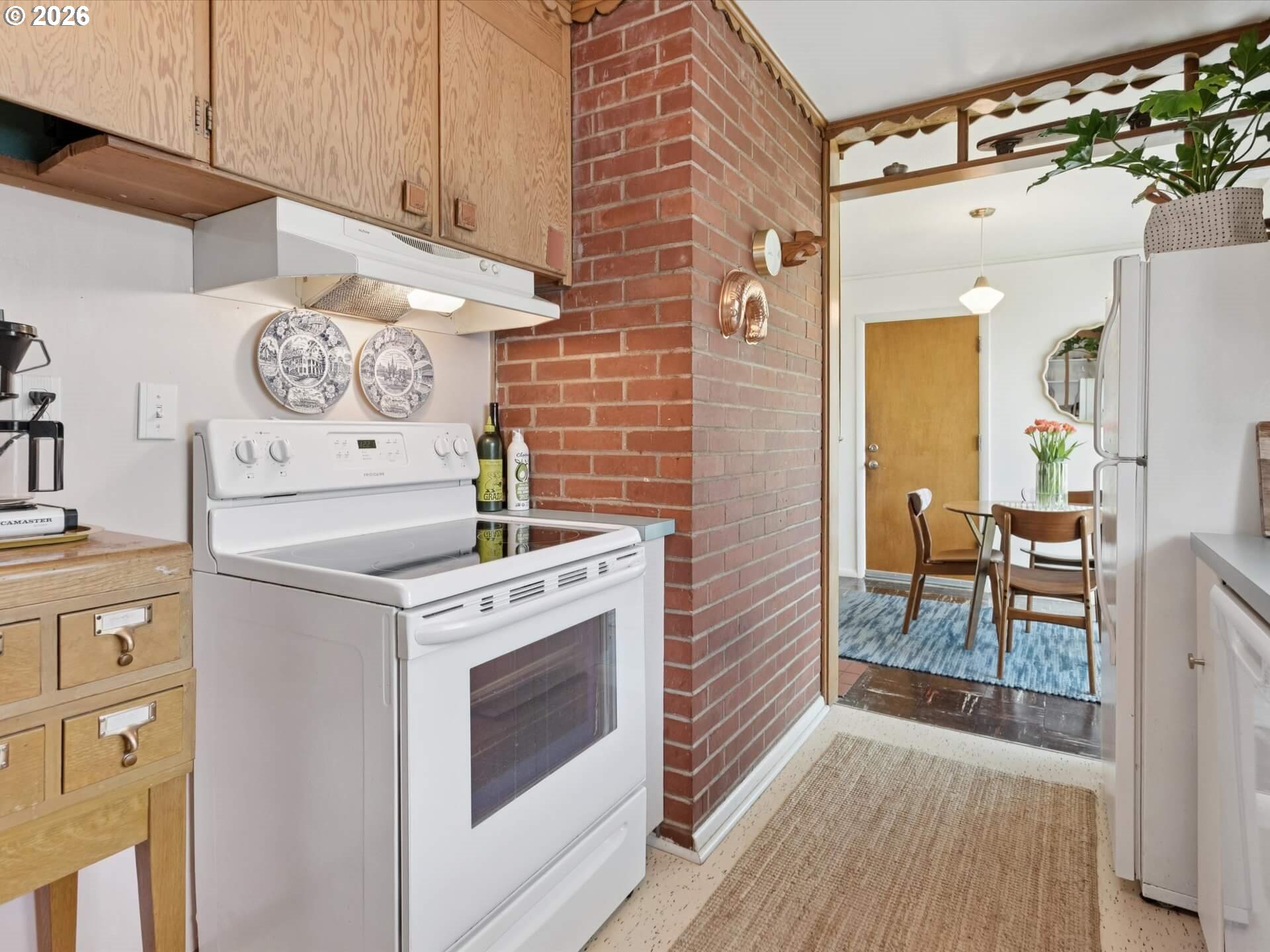 6030 Southeast 80th Avenue Portland, OR 97206 - Photo 18 of 42 a kitchen with a stove and a refrigerator