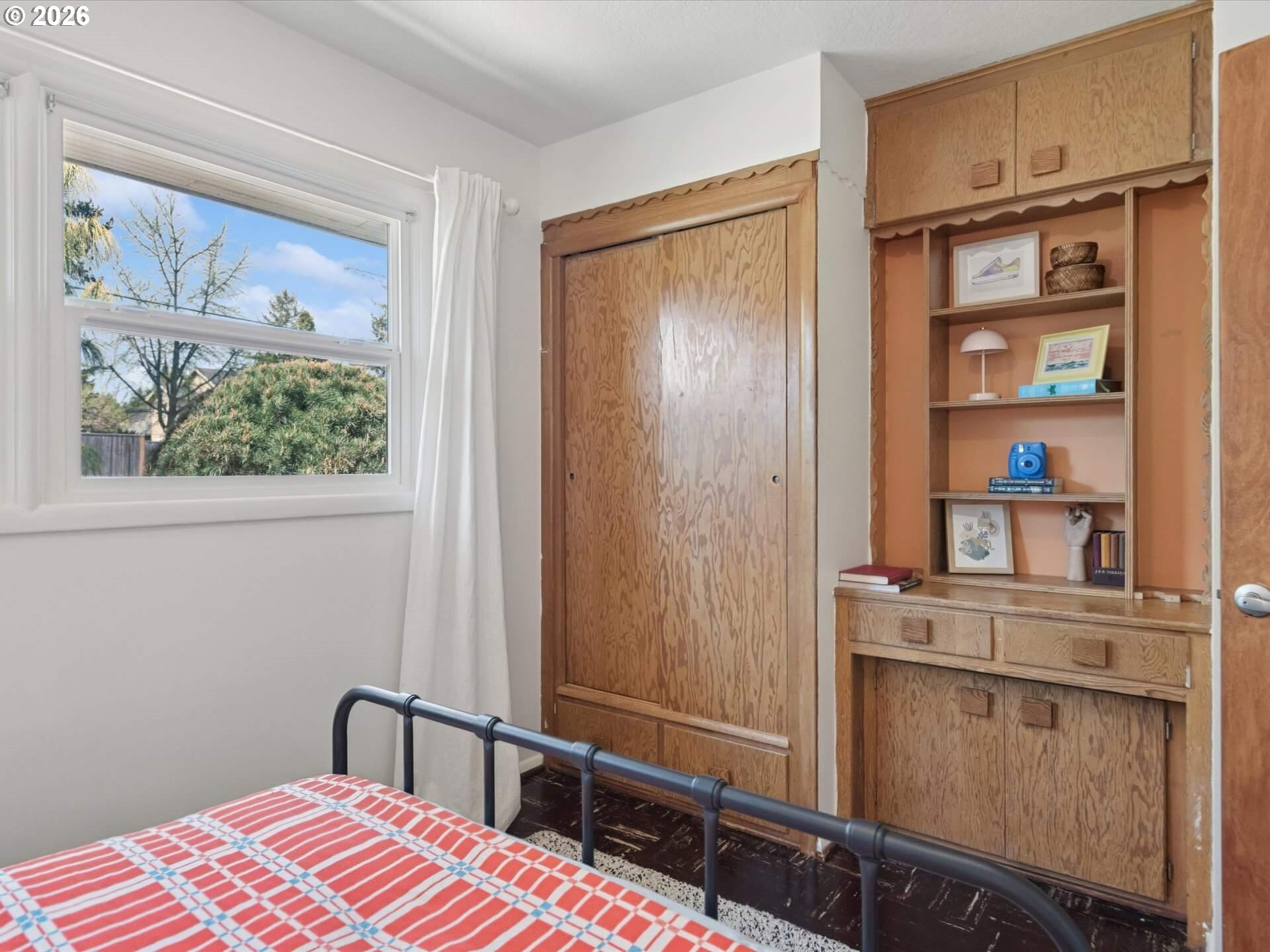 6030 Southeast 80th Avenue Portland, OR 97206 - Photo 27 of 42 a bedroom with a bed and a window