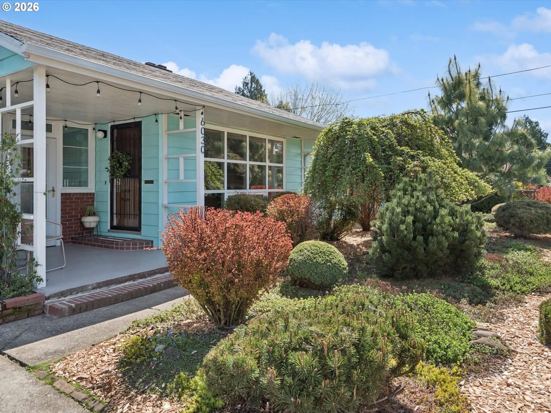 6030 Southeast 80th Avenue Portland, OR 97206 - Photo 3 of 42 a view of a house with backyard and sitting area