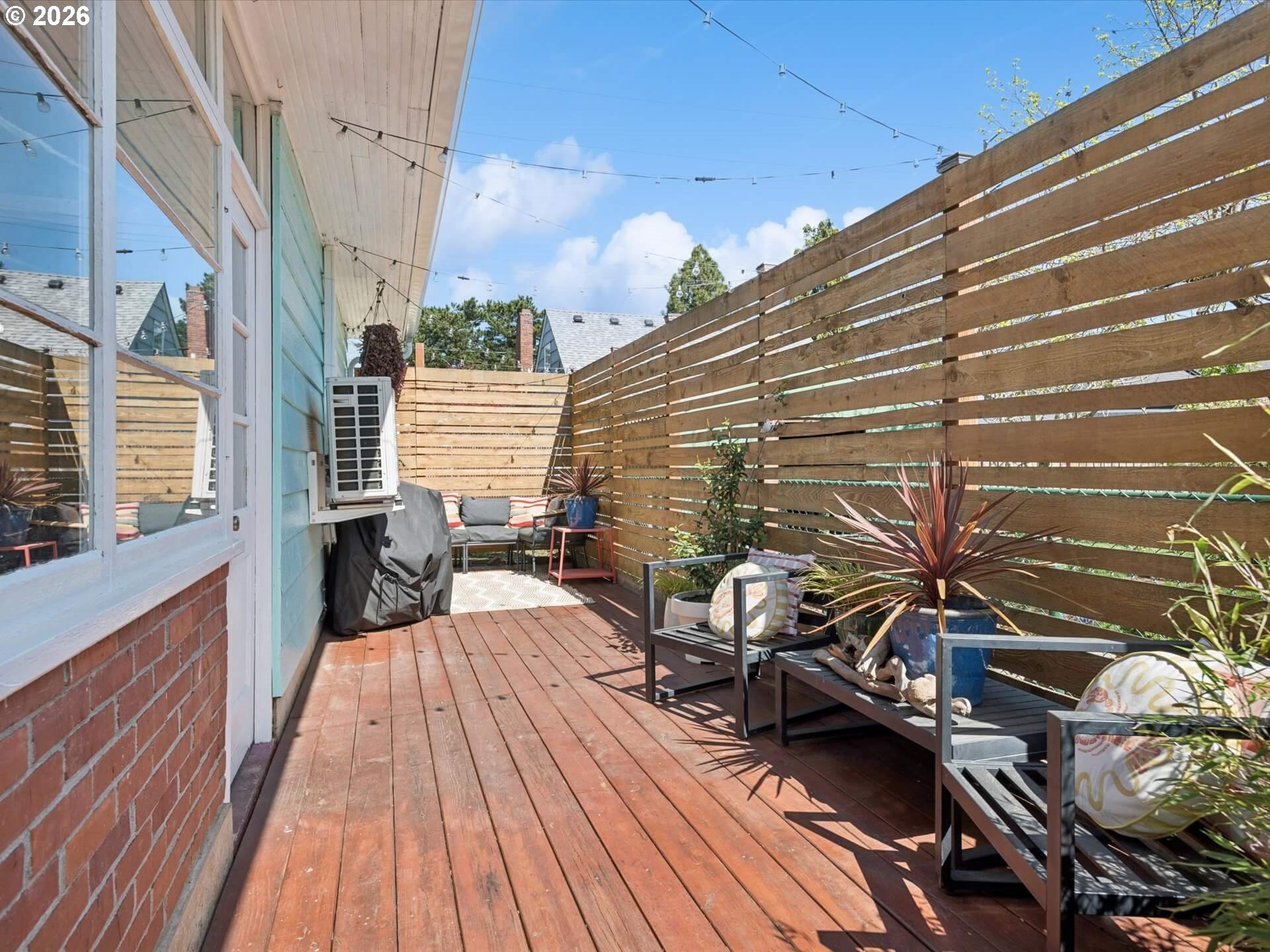 6030 Southeast 80th Avenue Portland, OR 97206 - Photo 37 of 42 a view of balcony with couch and wooden floor