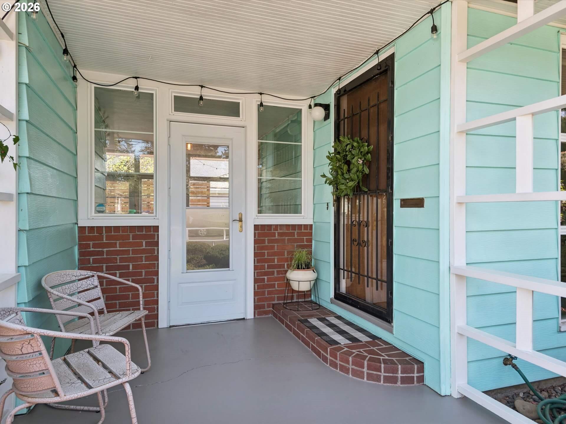 6030 Southeast 80th Avenue Portland, OR 97206 - Photo 4 of 42 a front view of a house with a glass door