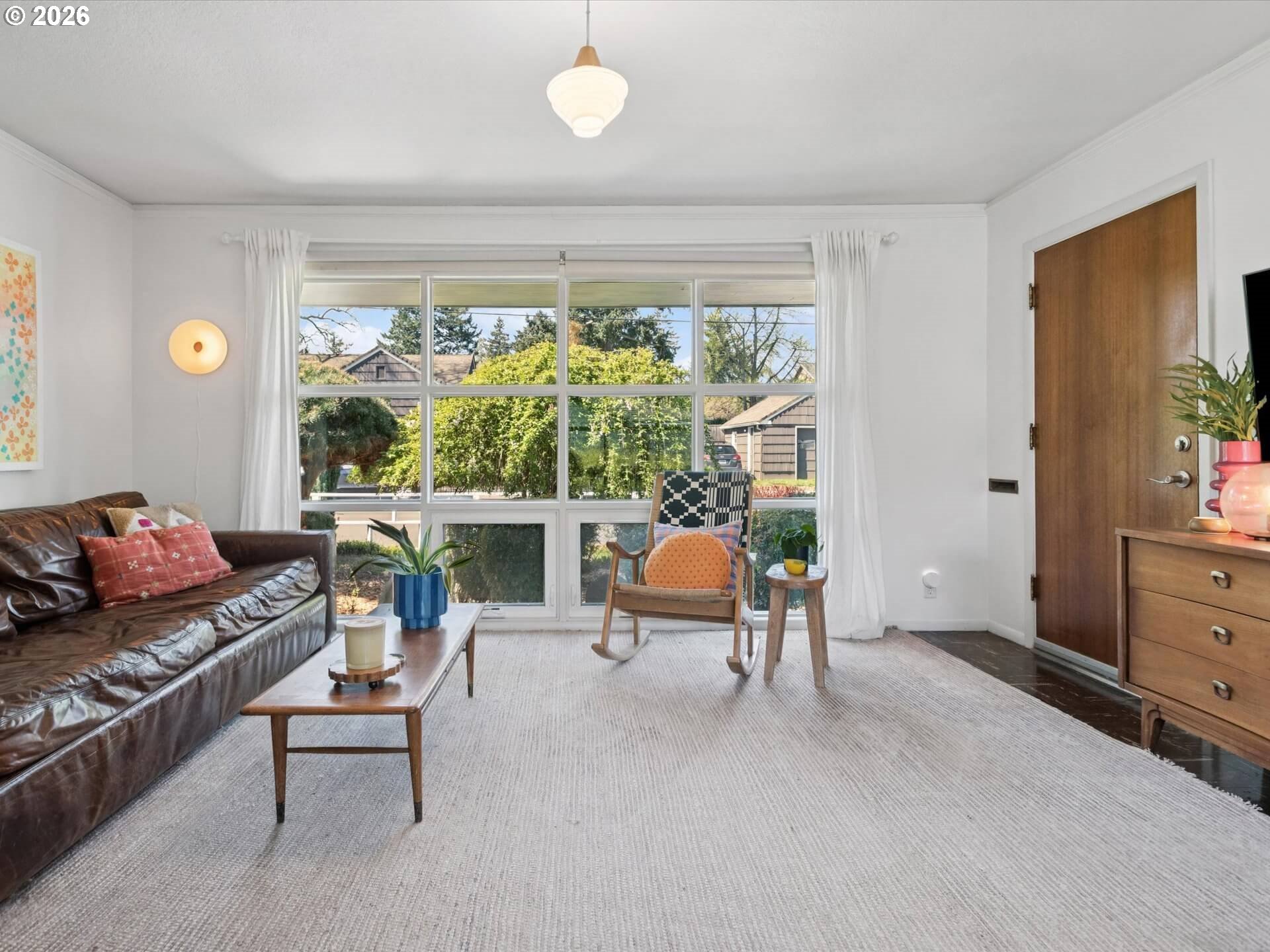 6030 Southeast 80th Avenue Portland, OR 97206 - Photo 6 of 42 a living room filled with furniture and a large window