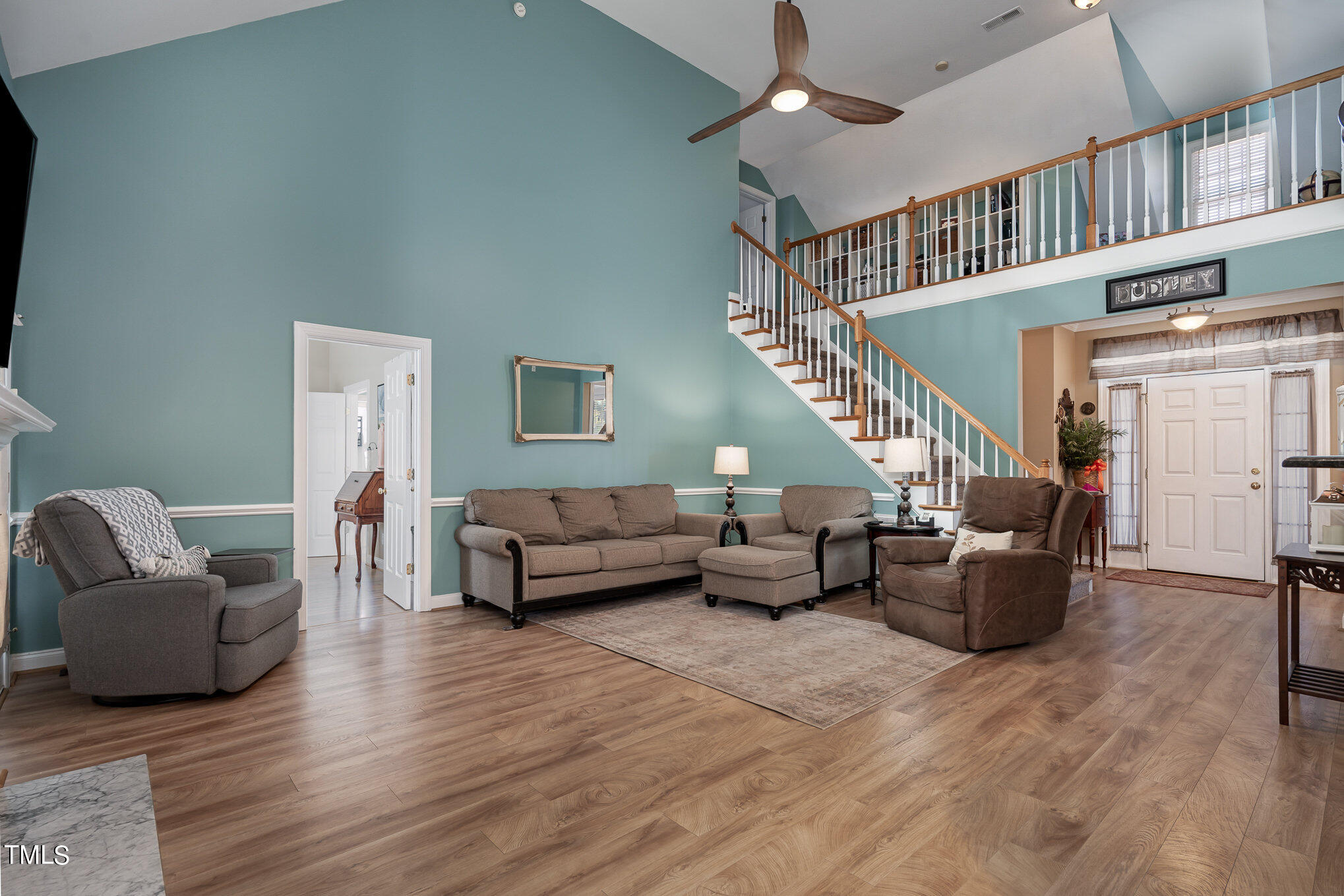 4520 Deer Stream Lane Raleigh, NC 27603 - Photo 8 of 35 a living room with furniture and stairs