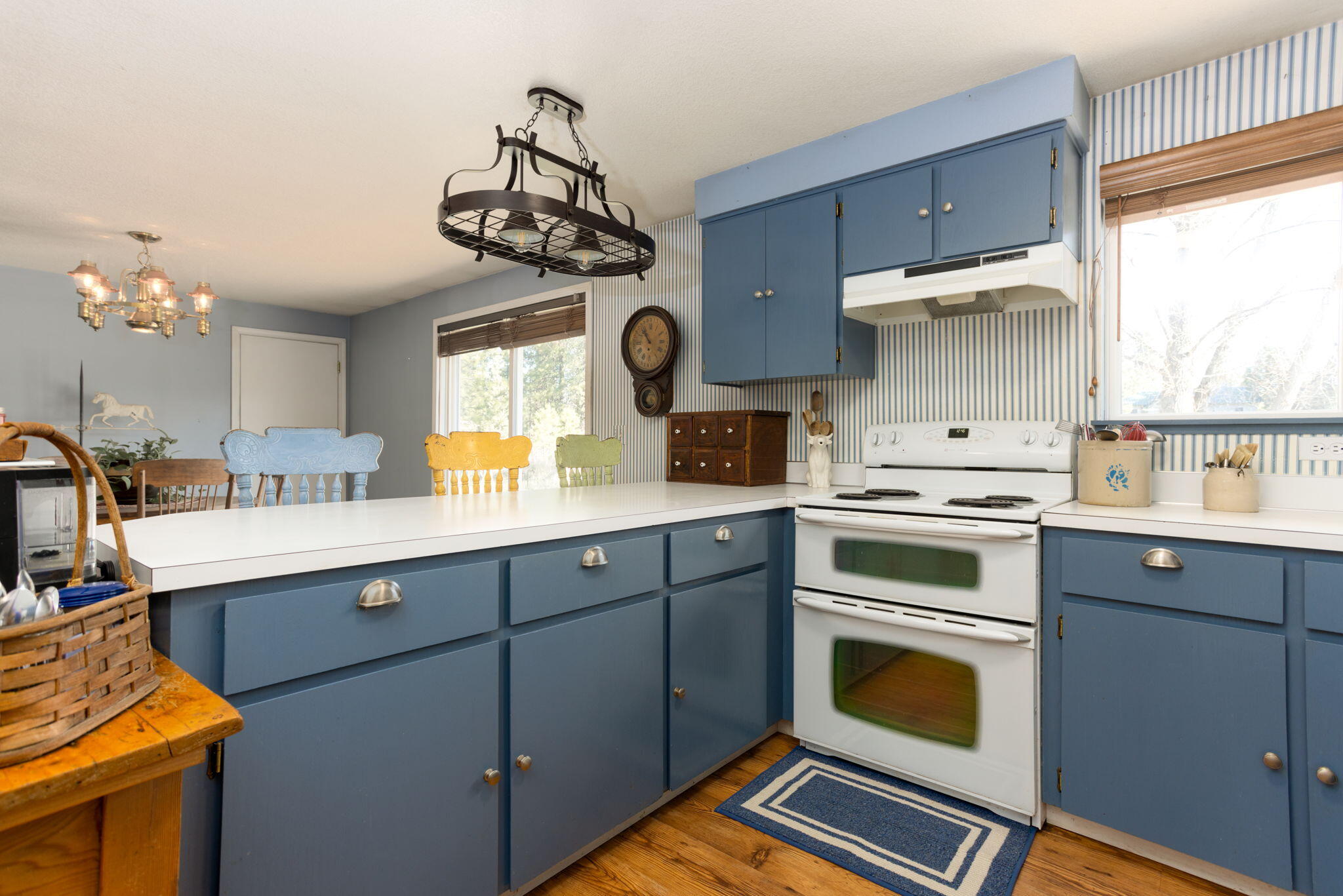 19450 Calico Road Bend, OR 97702 - Photo 12 of 41 a kitchen with a stove a sink and a window