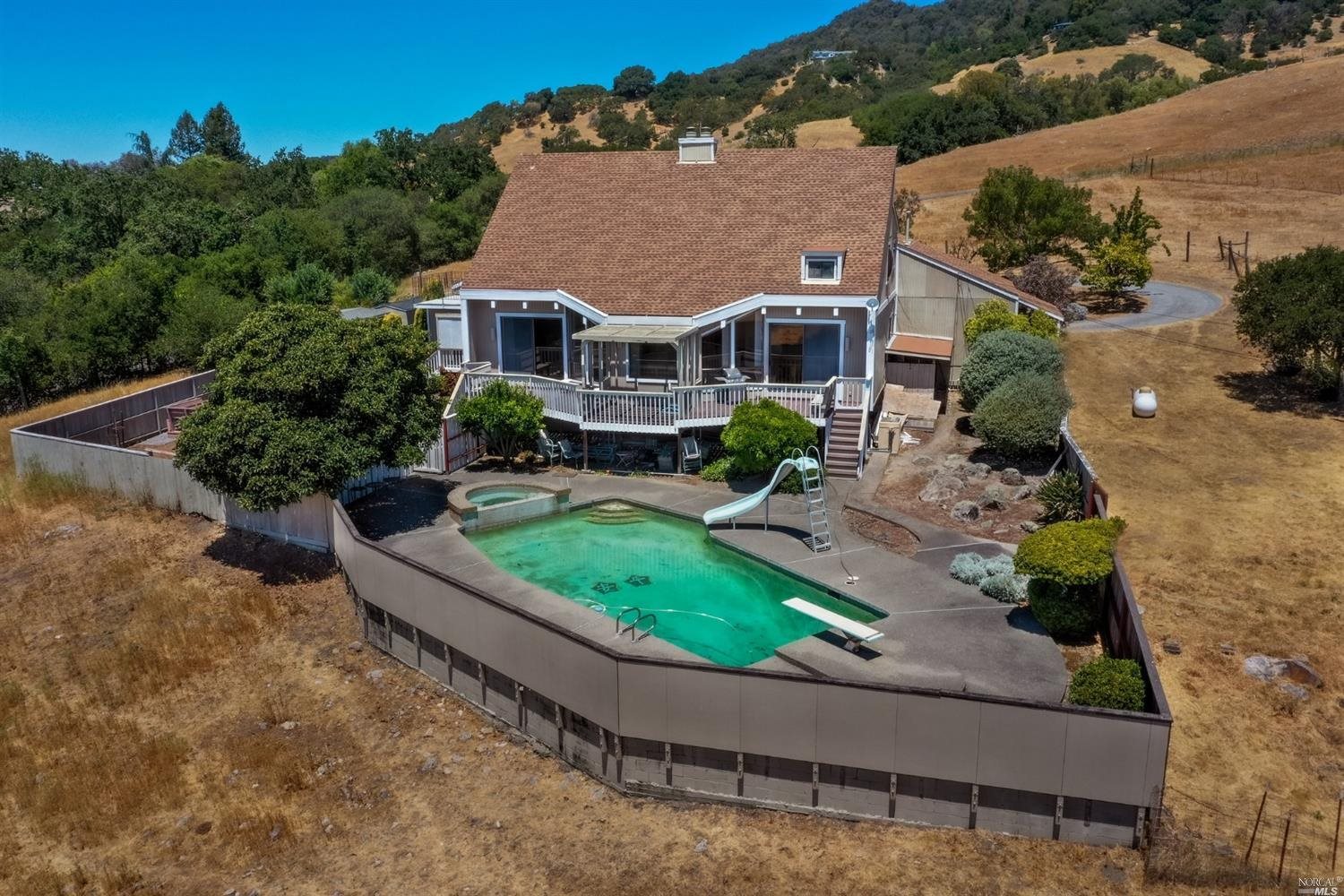 5050 Petaluma Hill Road Santa Rosa, CA 95404 - Photo 1 of 1 an aerial view of a house with a yard