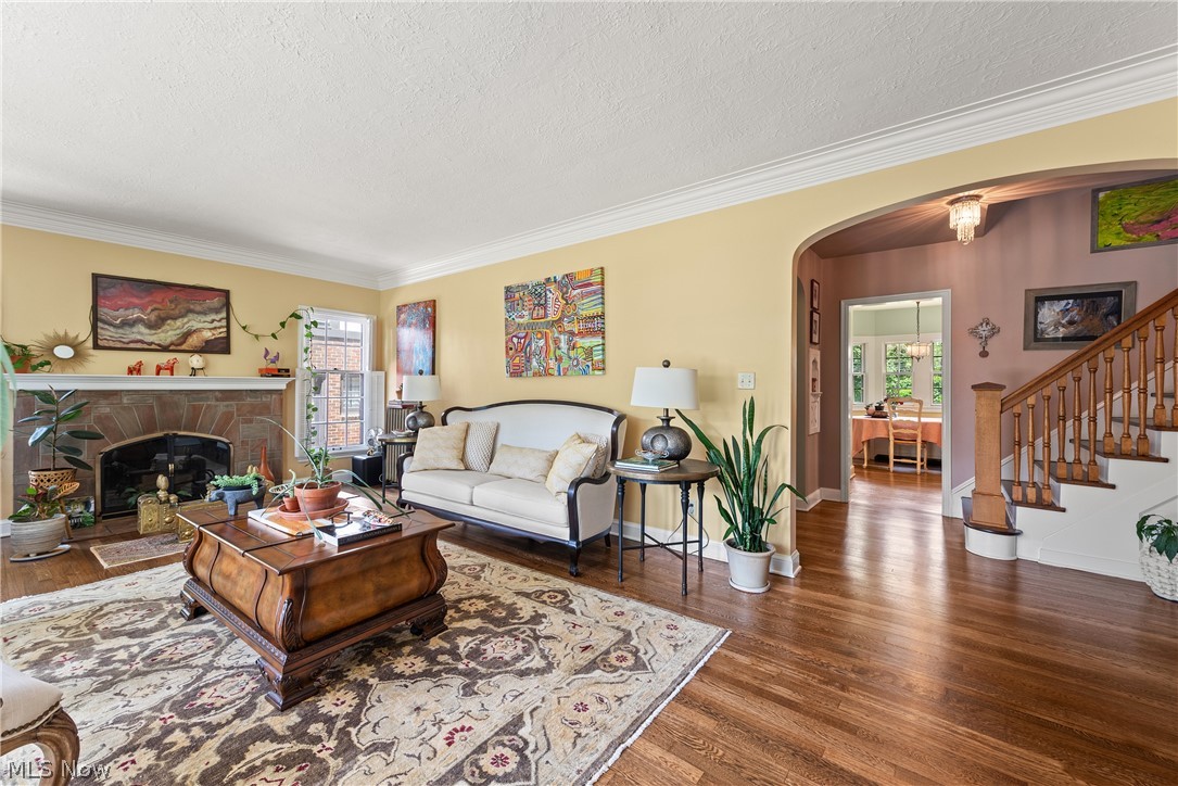 3349 Elsmere Road Cleveland, OH 44120 - Photo 6 of 50 Living room with crown molding, hardwood / wood-style flooring, and a textured ceiling