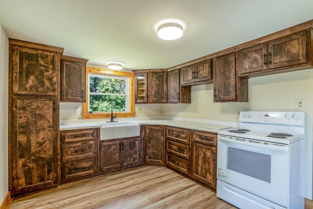 681 Downing Road Stockport, OH 43787 - Photo 4 of 36 kitchen sink cabinets and stove