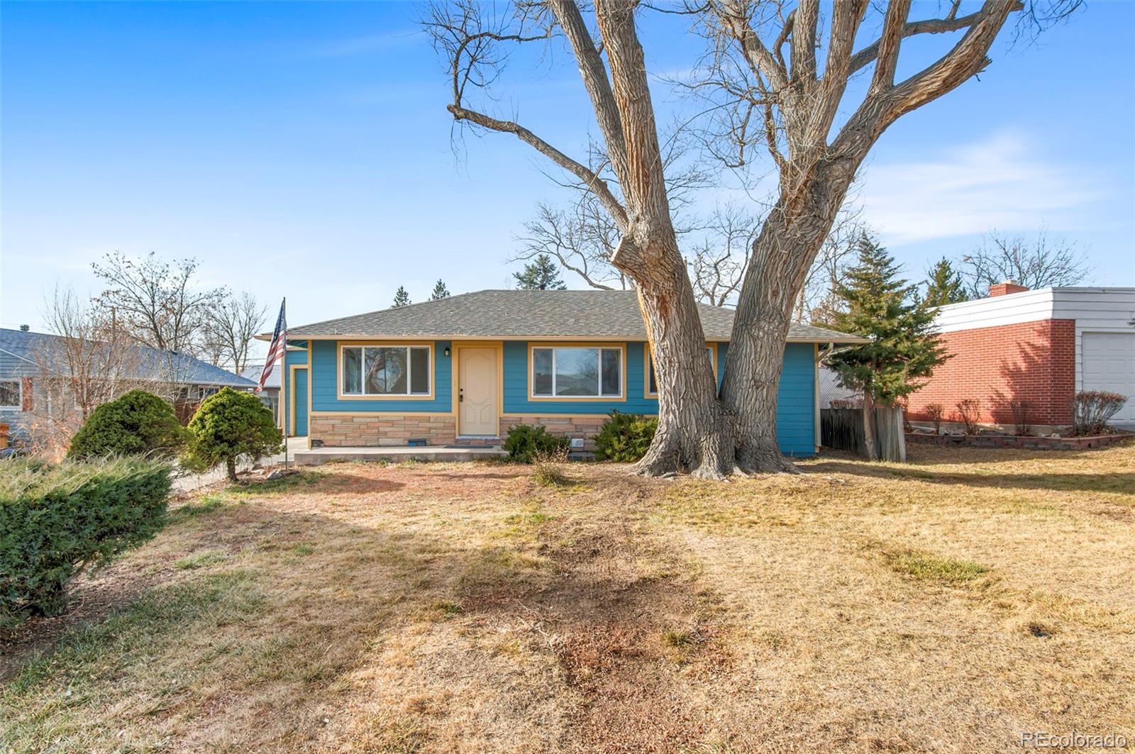 7483 Knox Court Westminster, CO 80030 - Photo 1 of 35 a front view of a house with a yard