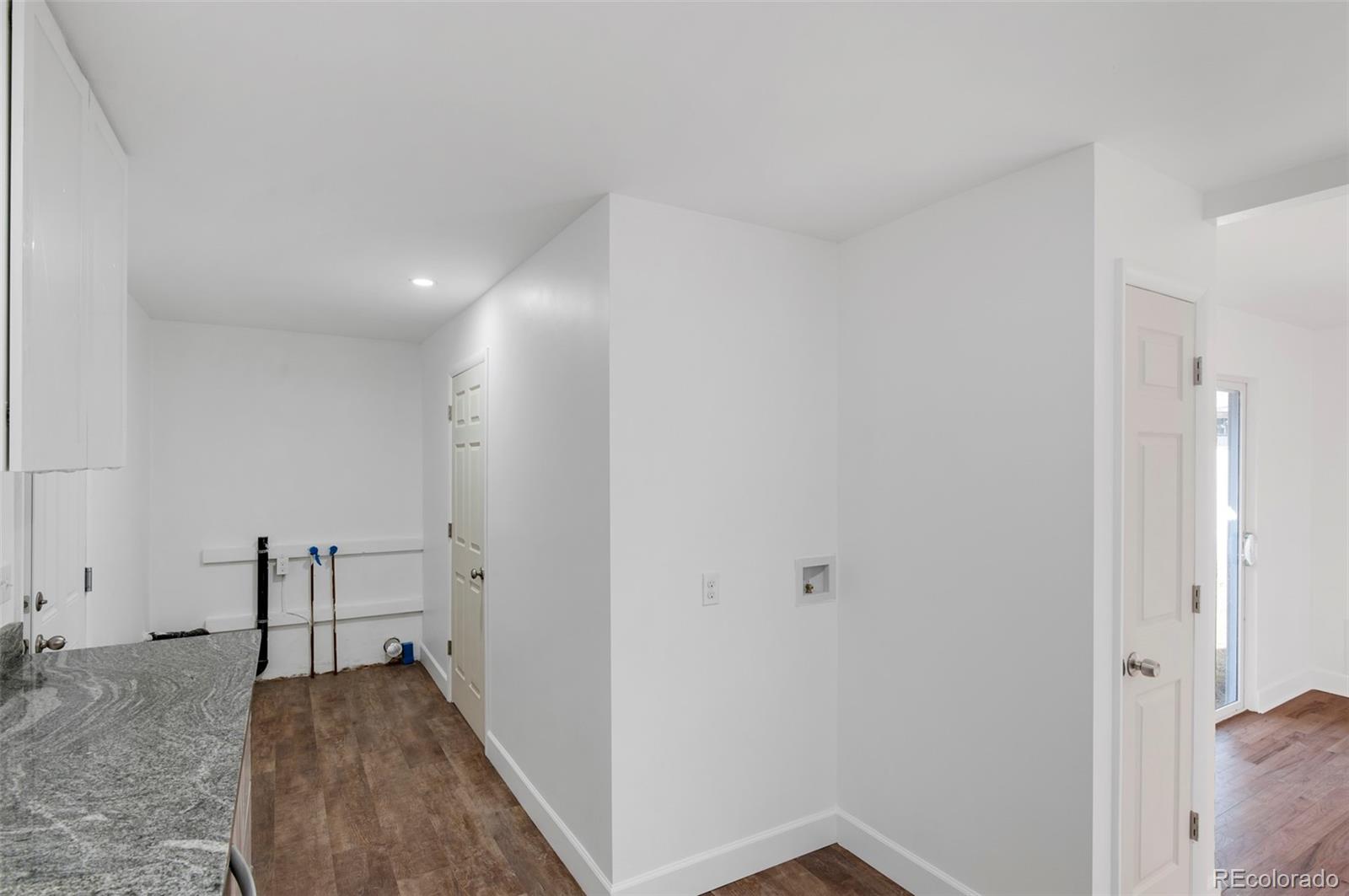7483 Knox Court Westminster, CO 80030 - Photo 24 of 35 a view of a hallway