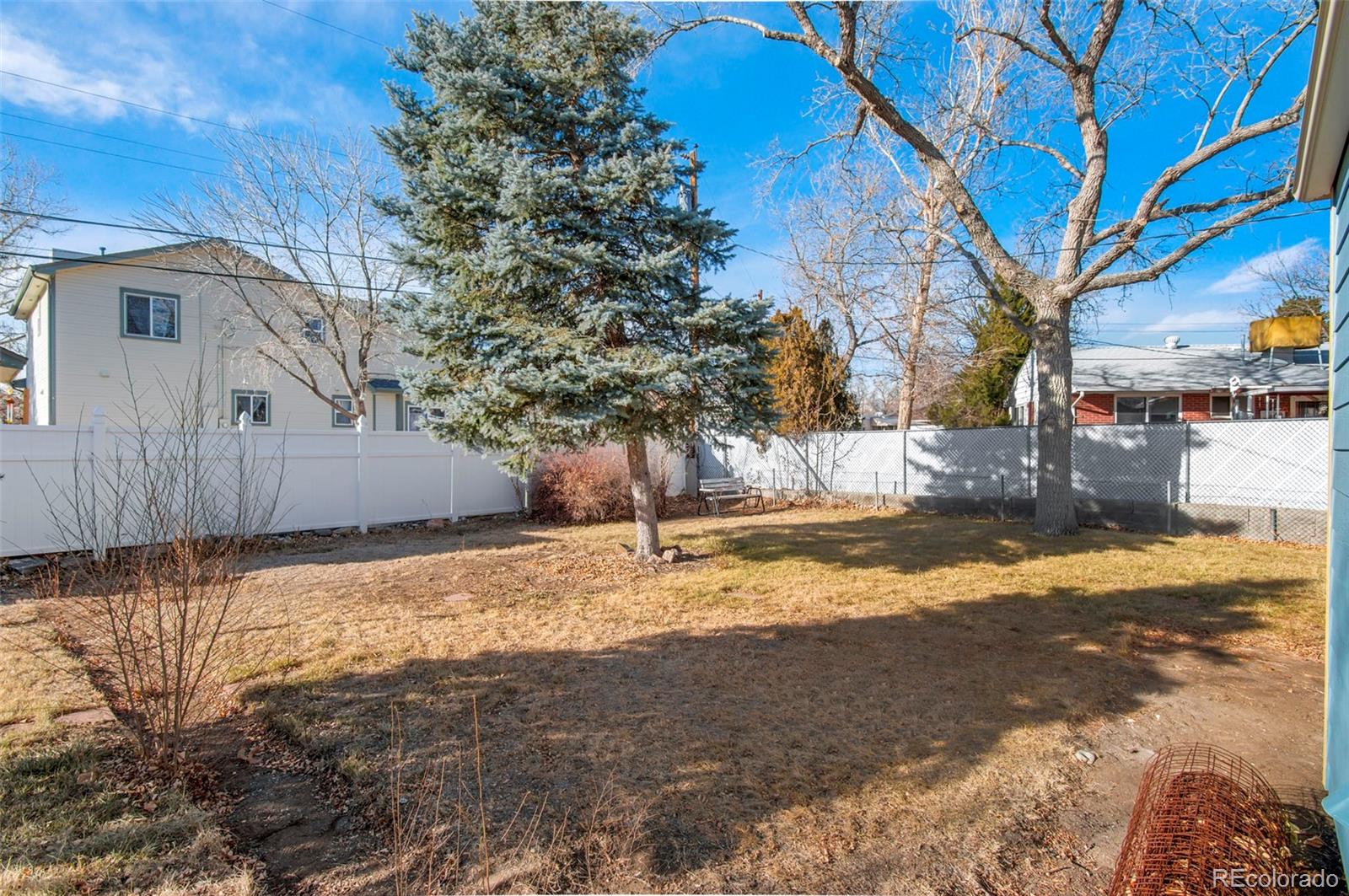 7483 Knox Court Westminster, CO 80030 - Photo 31 of 35 a view of a yard with snow on the road