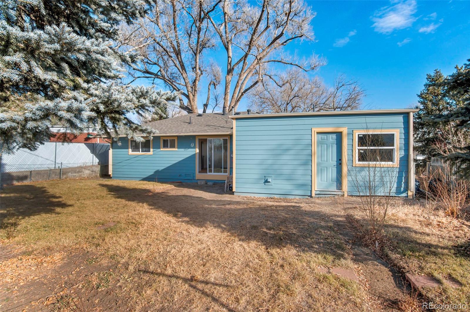 7483 Knox Court Westminster, CO 80030 - Photo 35 of 35 a front view of a house with a yard