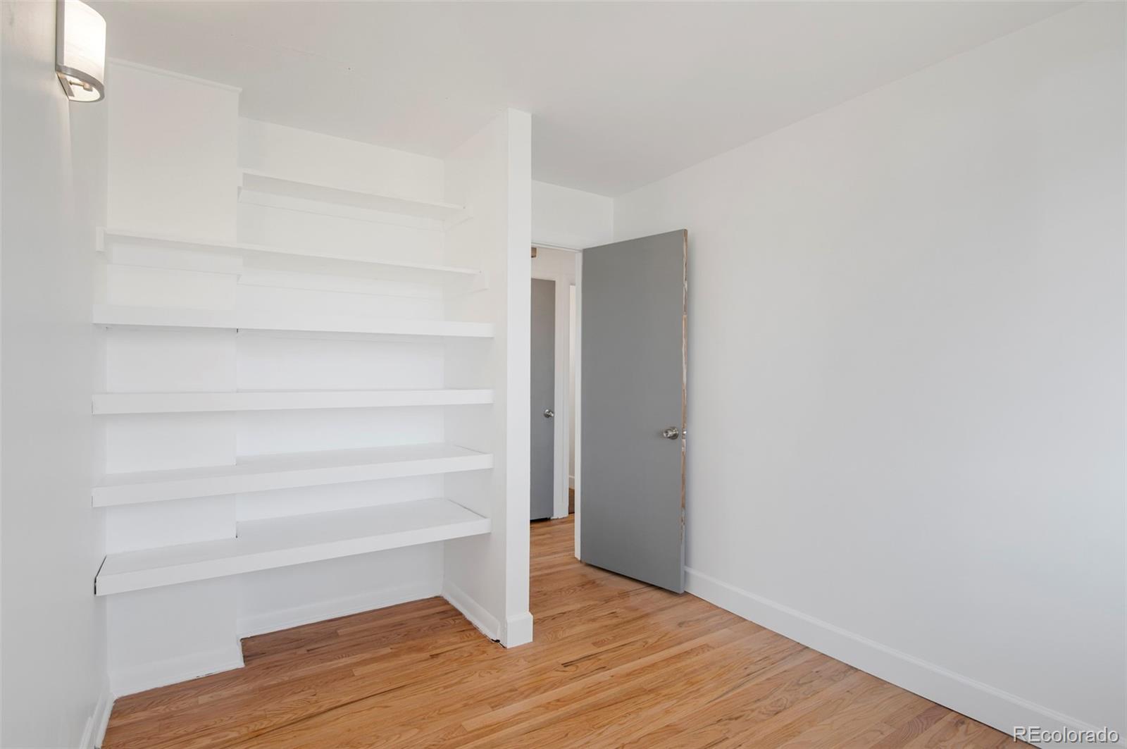 7483 Knox Court Westminster, CO 80030 - Photo 7 of 35 a view of an empty walk in closet