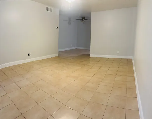 an empty room with white walls