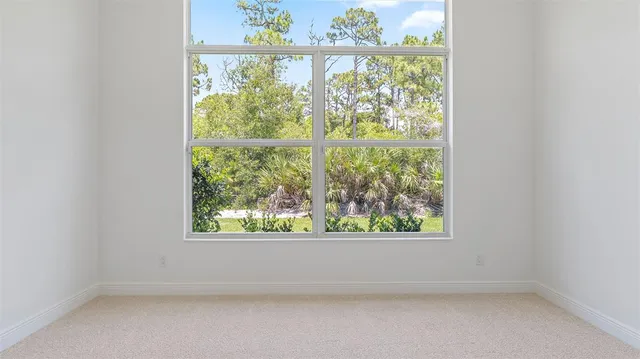 a bathroom with double vanity sink a mirror and a shower