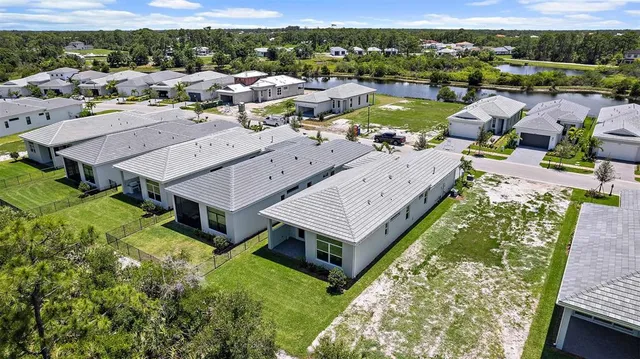 an aerial view of a house with a ocean view