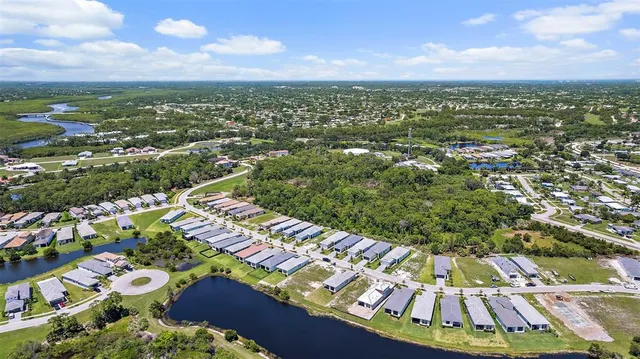 an aerial view of residential houses with outdoor space