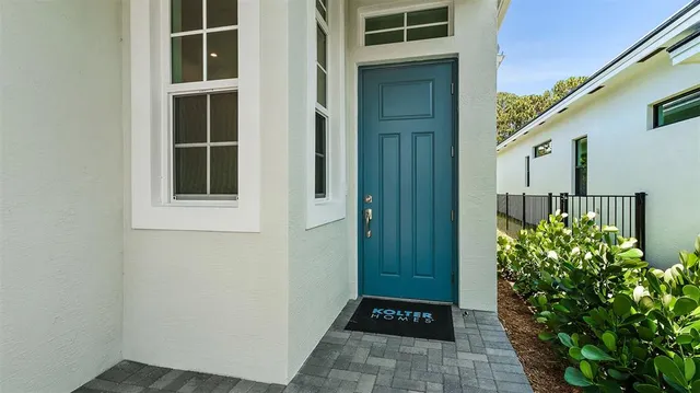 a view of front door and yard