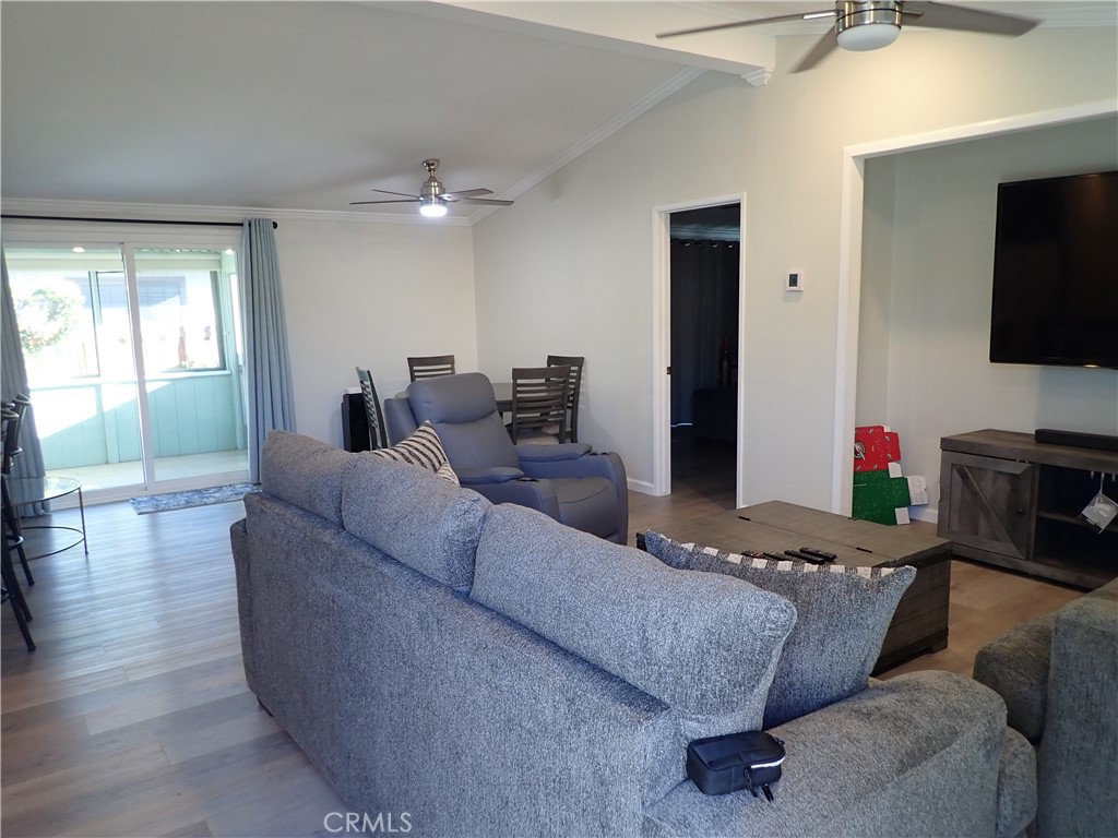 27250 Murrieta Road, Unit 386 Menifee, CA 92586 - Photo 4 of 32 a living room with furniture and a flat screen tv