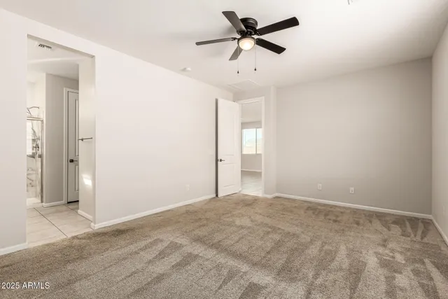 a view of a big room with wooden floor and cabinet
