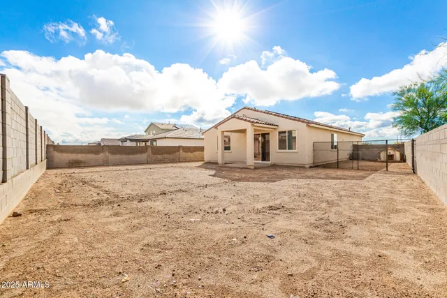 a view of a house with a backyard of the house
