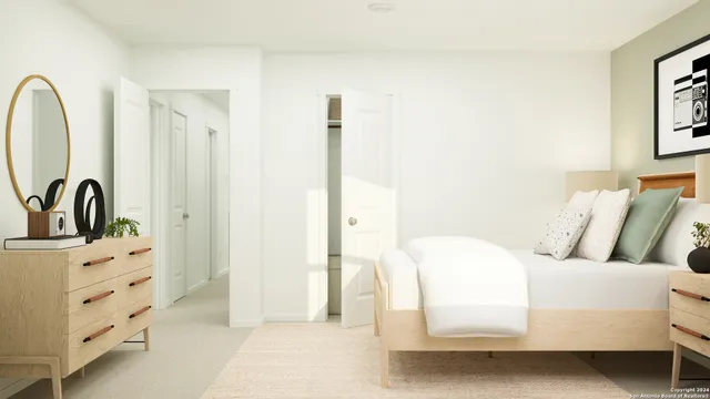 a spacious bedroom with a bed and a window