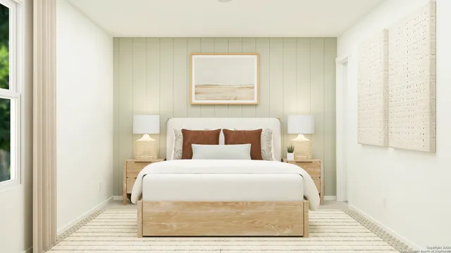 a large bed in a white room