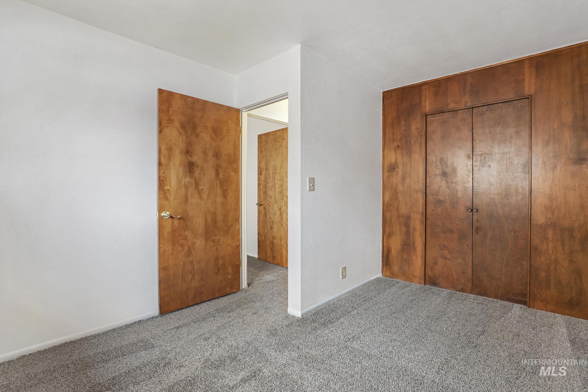 409 Clear Lakes Road Buhl, ID 83316 - Photo 20 of 43 Unfurnished bedroom featuring a closet and carpet floors