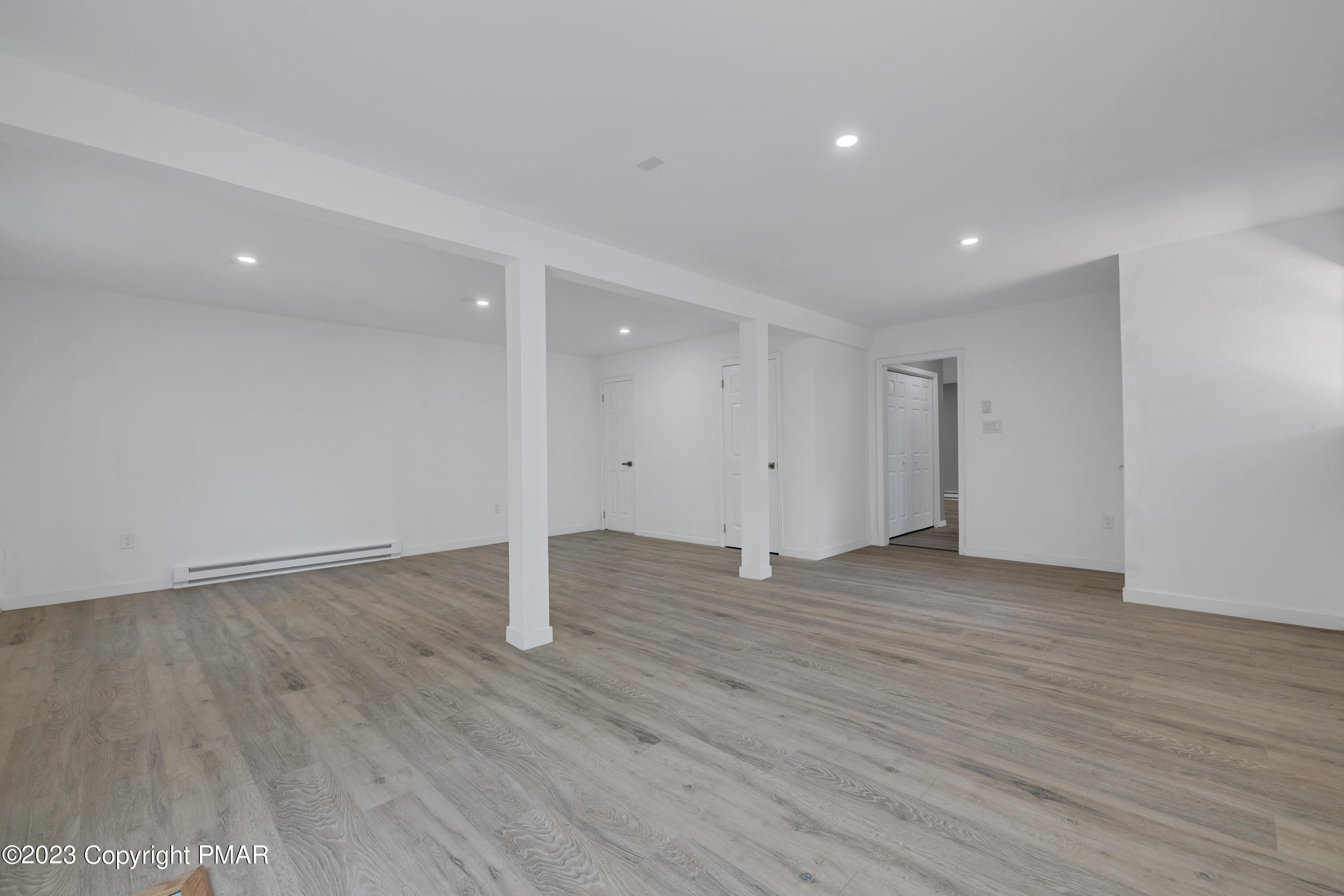 209 Ryan Road Blakeslee, PA 18610 - Photo 26 of 54 a view of an empty room with wooden floor