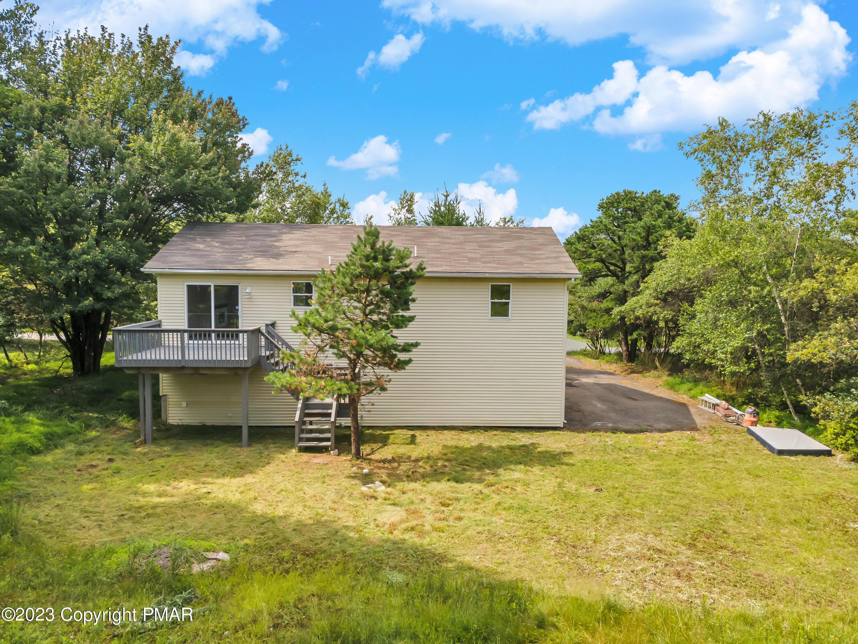 209 Ryan Road Blakeslee, PA 18610 - Photo 44 of 54 a house view with a swimming pool
