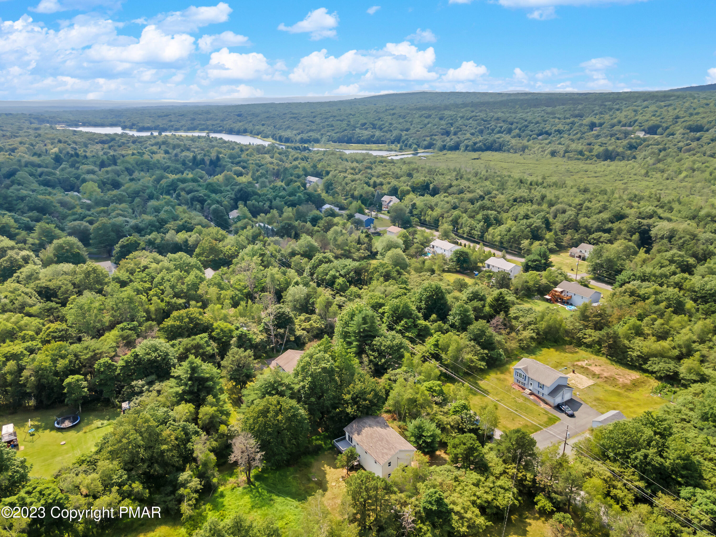 209 Ryan Road Blakeslee, PA 18610 - Photo 48 of 54 an aerial view of residential houses with outdoor space and trees