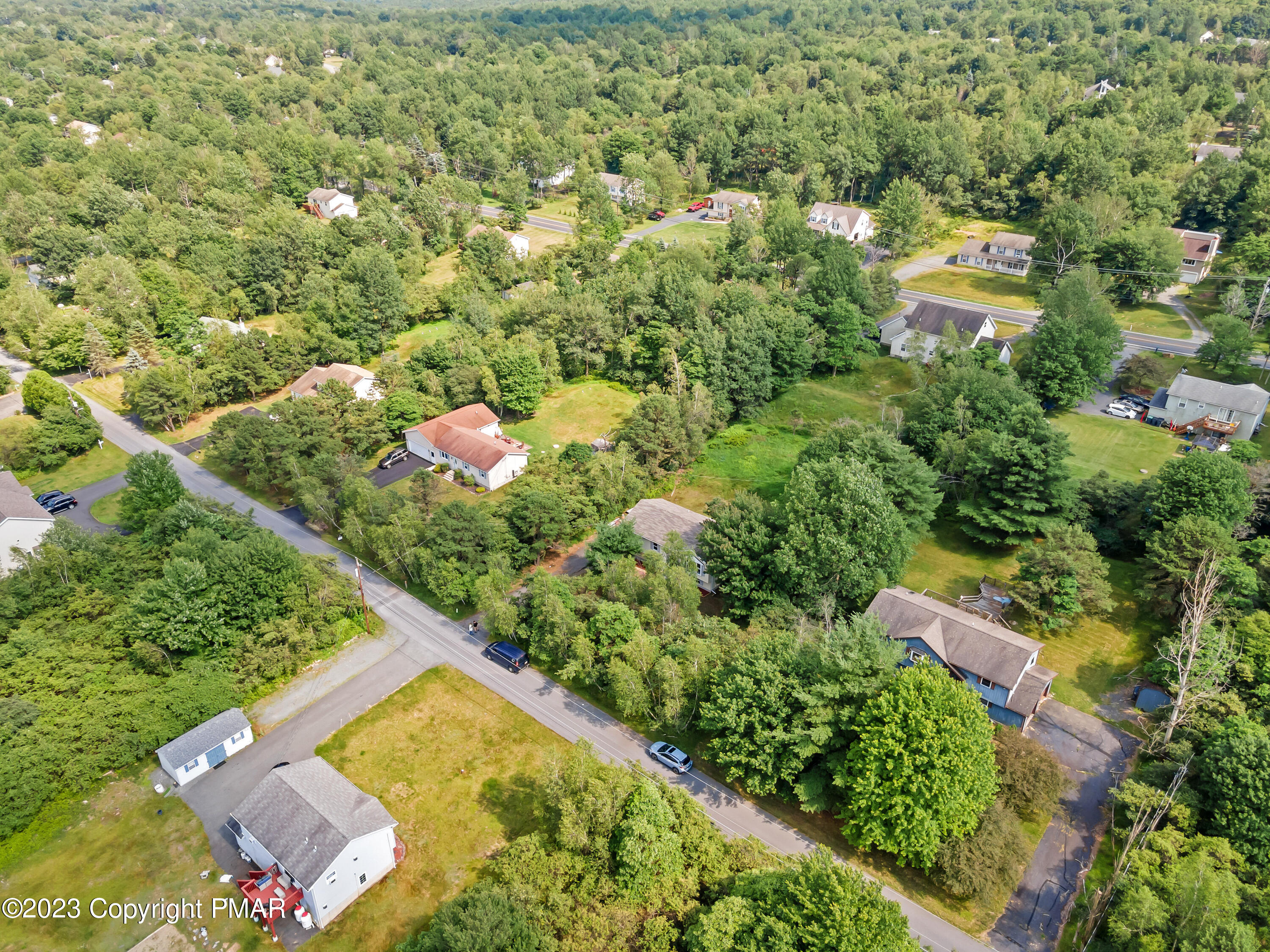 209 Ryan Road Blakeslee, PA 18610 - Photo 49 of 54 an aerial view of a house with a yard and lake view