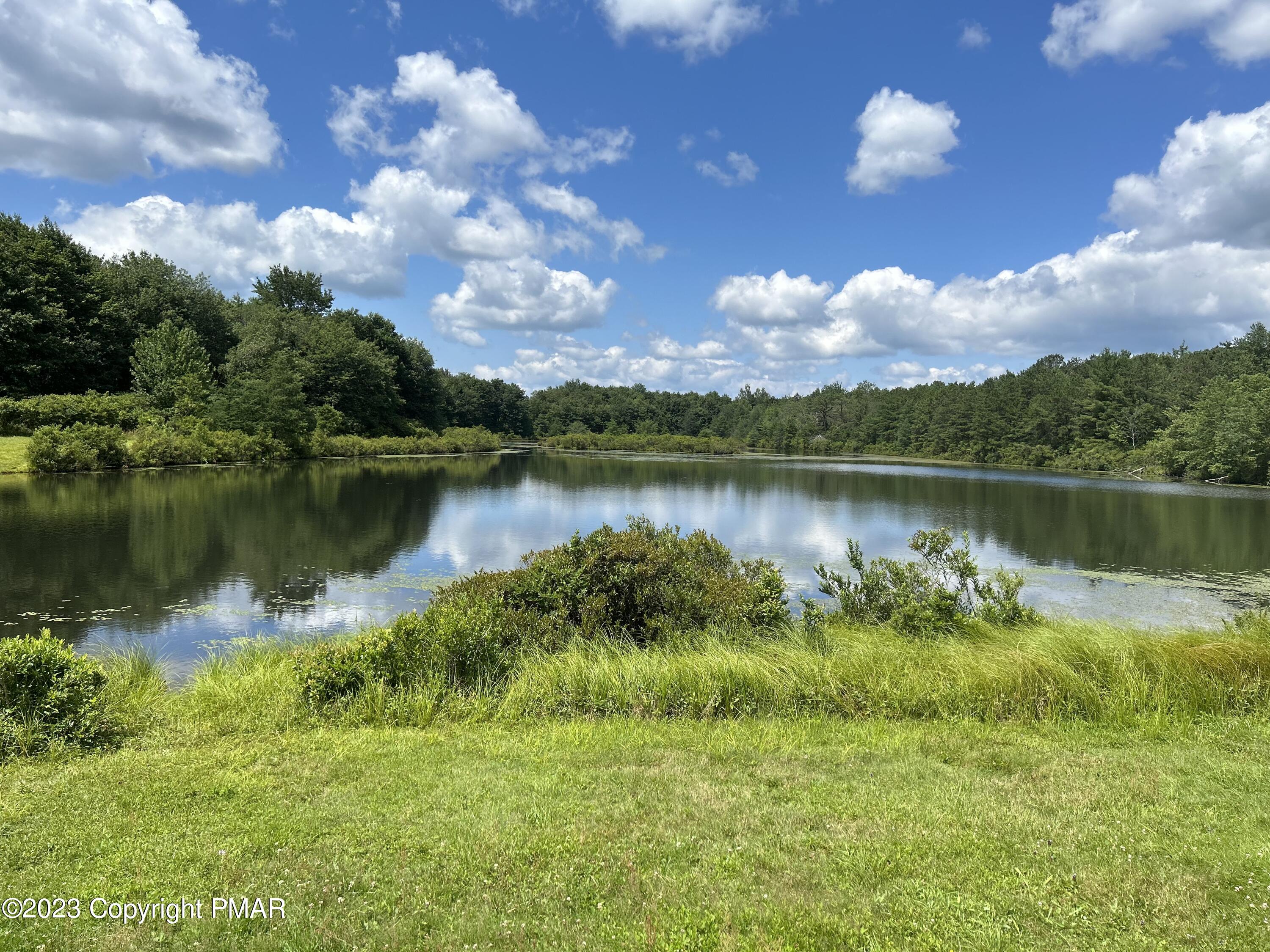 209 Ryan Road Blakeslee, PA 18610 - Photo 54 of 54 a view of a lake with houses in the back