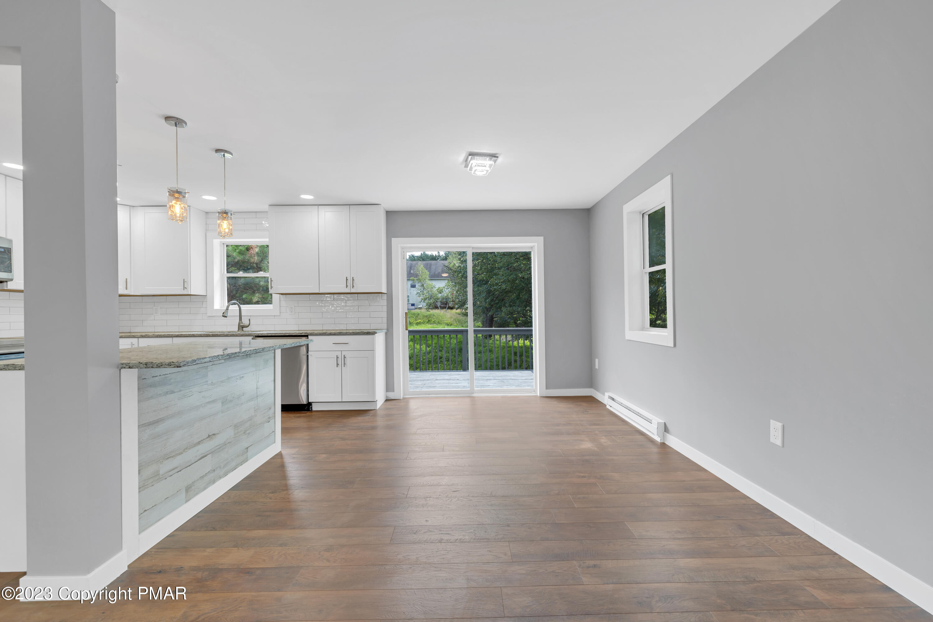 209 Ryan Road Blakeslee, PA 18610 - Photo 10 of 54 a kitchen with granite countertop white cabinets and white appliances