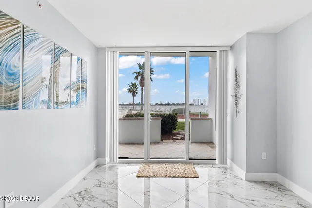 a view of a living room and entry way