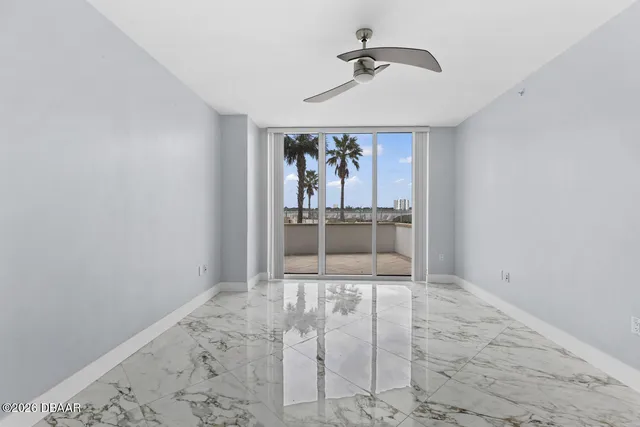 a bathroom with a granite countertop sink a toilet a mirror and shower