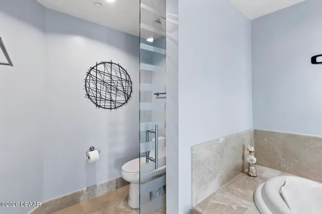 a bathroom with a bathtub and shower