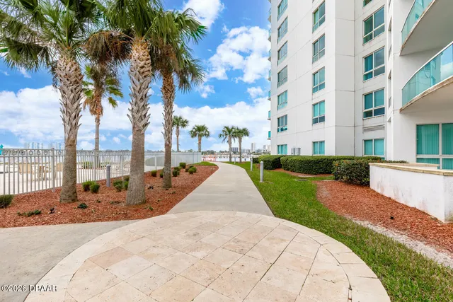 a view of a livingroom with furniture and staircase