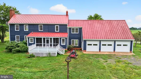 a kitchen with stainless steel appliances granite countertop a stove a refrigerator and a microwave