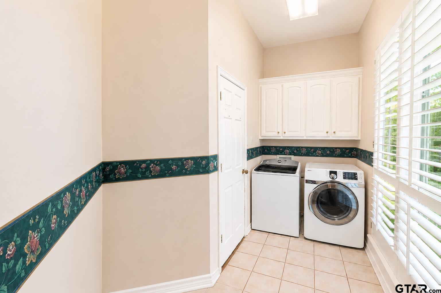 1388 Santa Fe Trail Tyler, TX 75703 - Photo 29 of 46 a utility room with dryer and washer