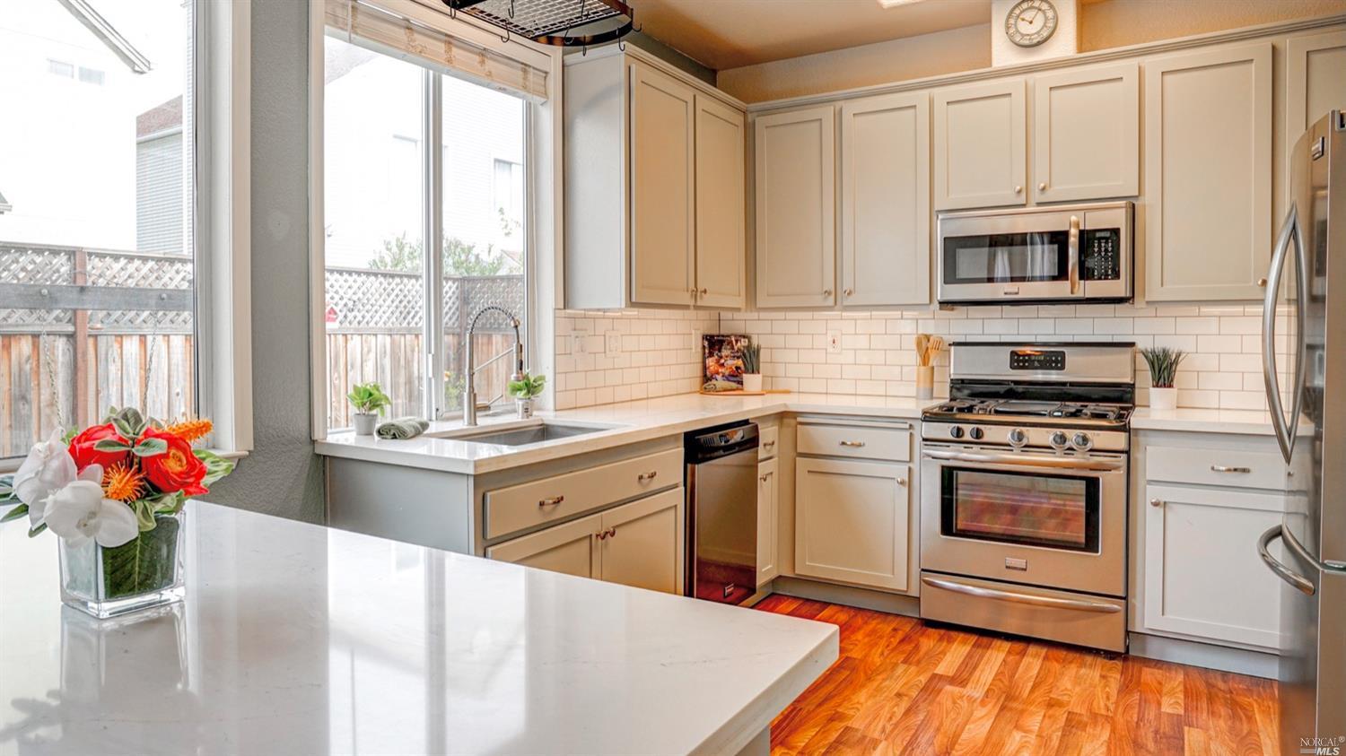2325 Brompton Avenue Santa Rosa, CA 95403 - Photo 1 of 1 a kitchen with stainless steel appliances granite countertop a stove a sink and a refrigerator