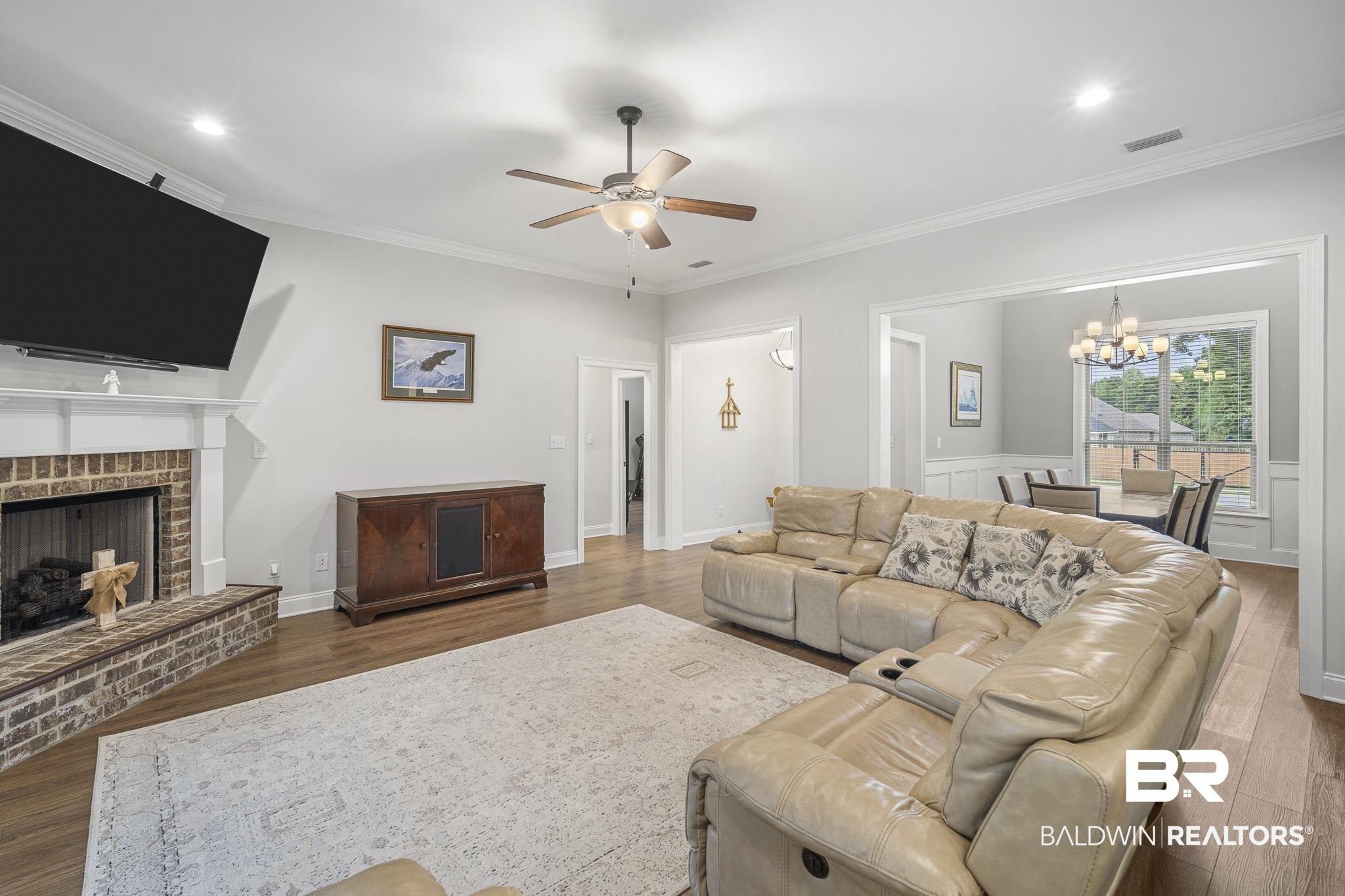 12672 Squirrel Drive Daphne, AL 36527 - Photo 8 of 49 Spacious living area featuring wood-finish flooring, a brick fireplace with a white mantle, recessed lighting, and a ceiling fan