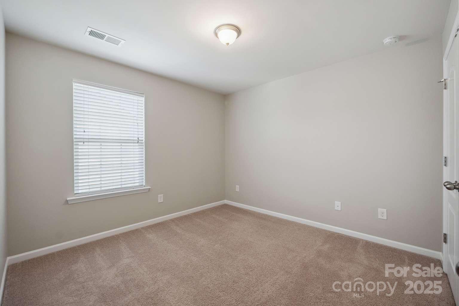 128 Yellowbell Road Mooresville, NC 28117 - Photo 15 of 19 an empty room with a window