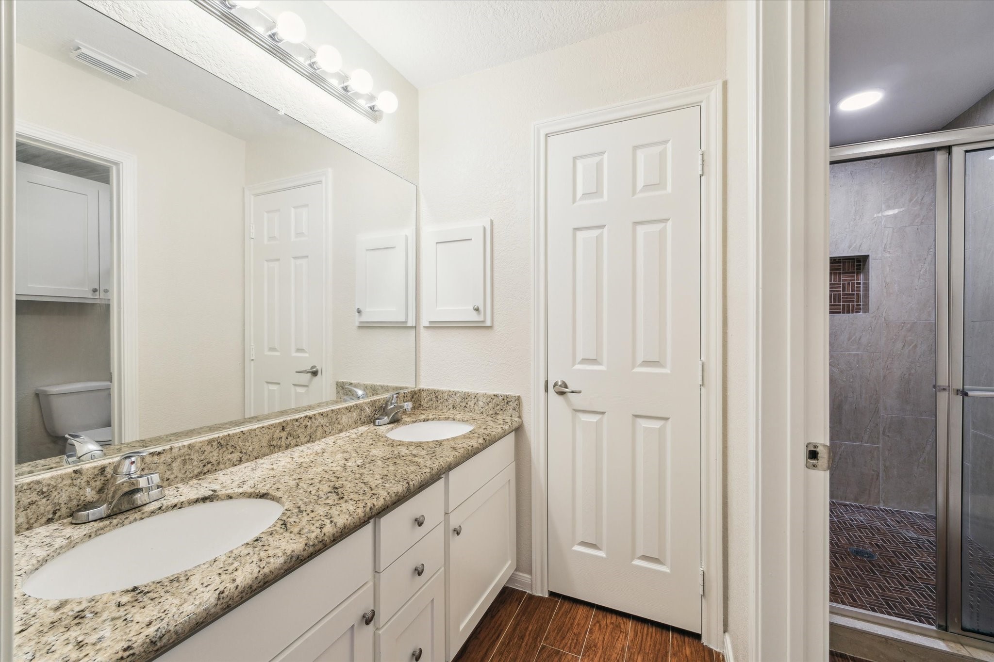 2806 Crescent Star Road Spring, TX 77388 - Photo 16 of 23 a bathroom with a granite countertop sink and a mirror