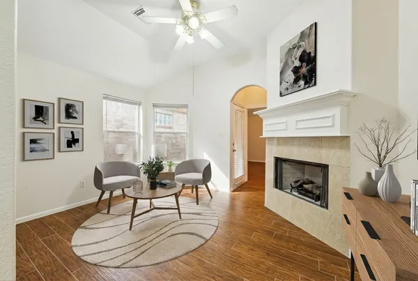 a living room with furniture and a fireplace