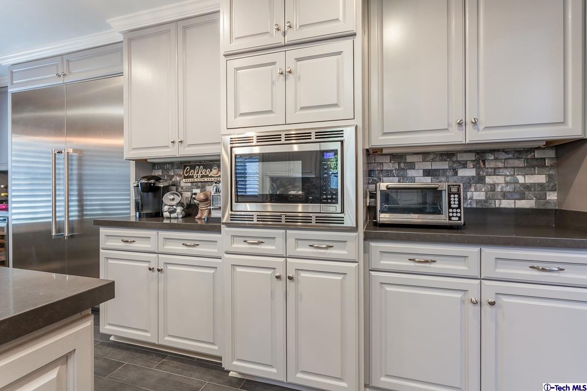 2017 Midwick Drive Altadena, CA 91001 - Photo 11 of 61 a kitchen with white cabinets and appliances