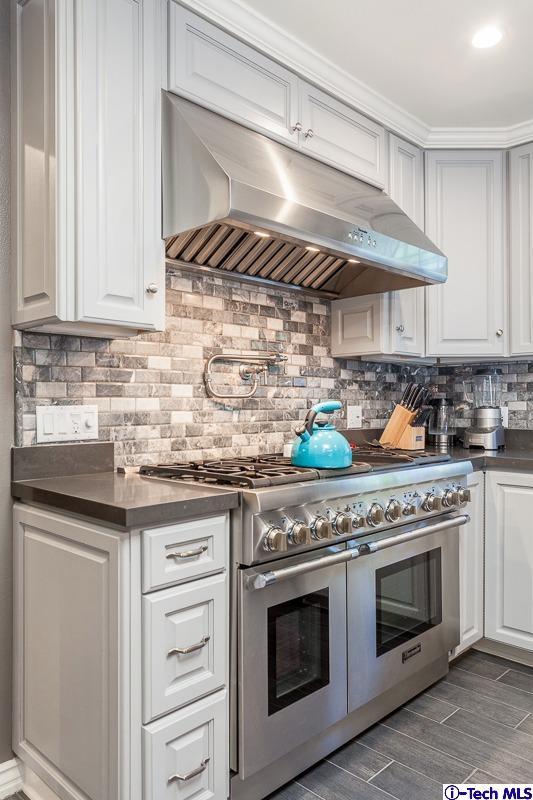 2017 Midwick Drive Altadena, CA 91001 - Photo 13 of 61 a kitchen with stainless steel appliances granite countertop a stove and a sink
