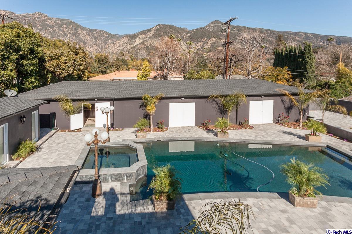 2017 Midwick Drive Altadena, CA 91001 - Photo 29 of 61 a front view of a house with a yard table and chairs